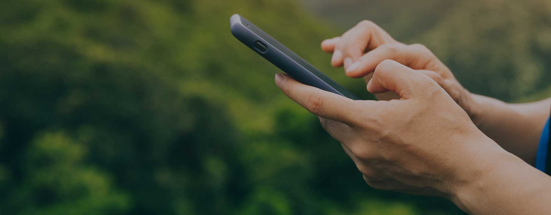 women hiking using a smart phone