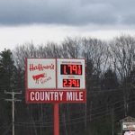 Country mile store sign